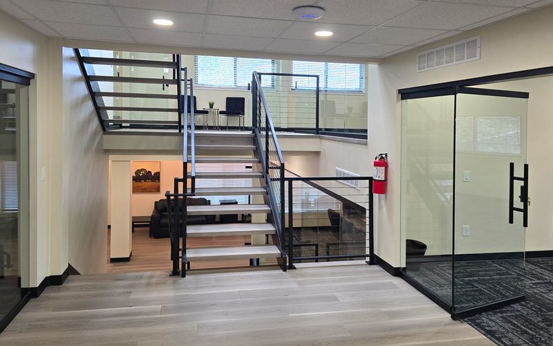 Central staircase and lounge at ZipDesk Coworking