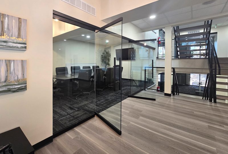 Lounge artwork and glass conference room at ZipDesk Coworking