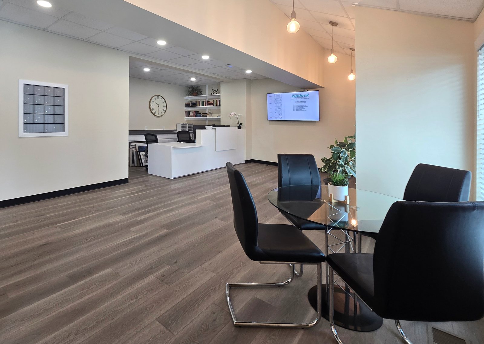 Reception, mailboxes and client seating at ZipDesk Coworking